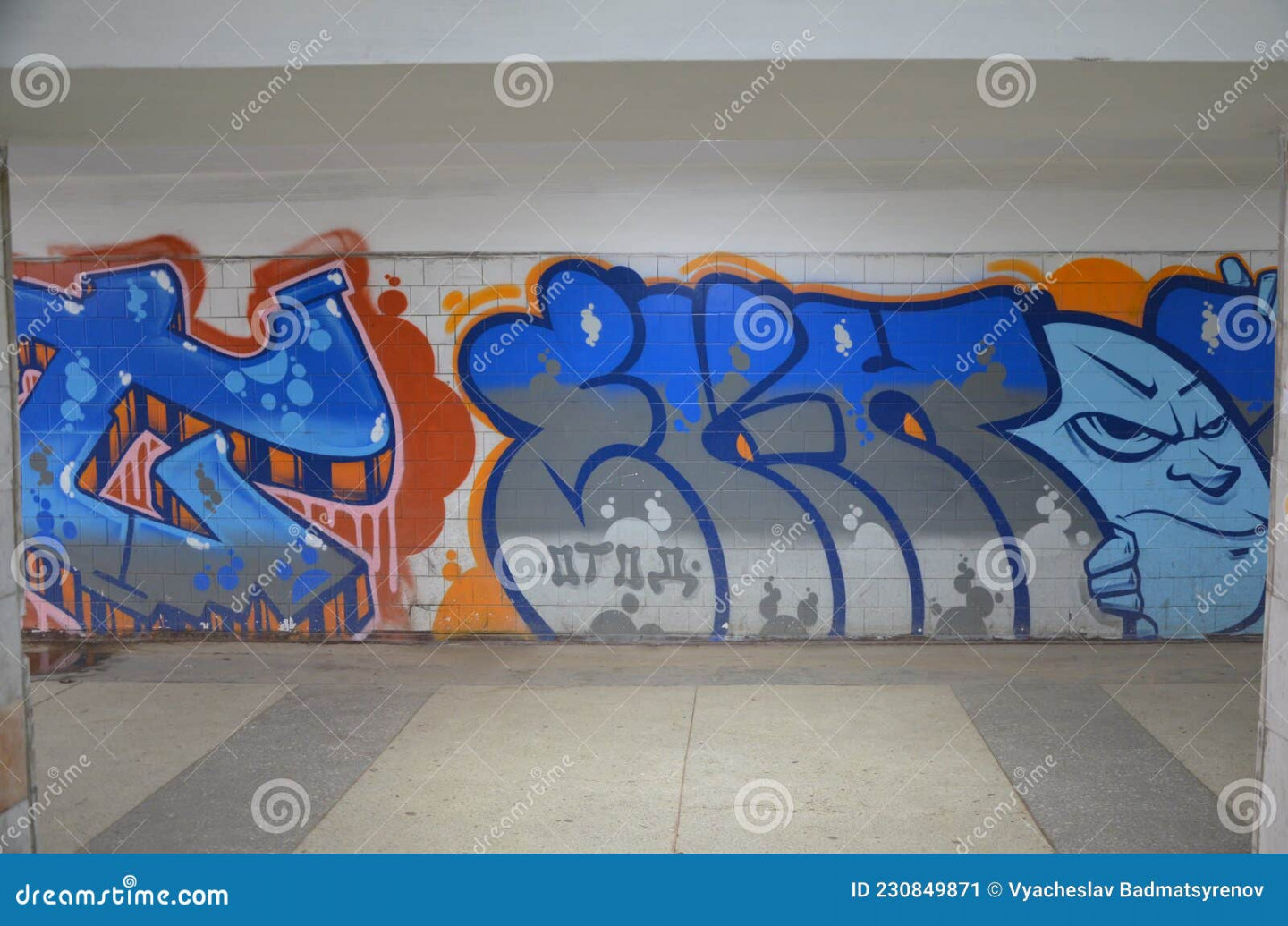 A Graffiti with Face and Letters on a Wall Editorial Photo - Image