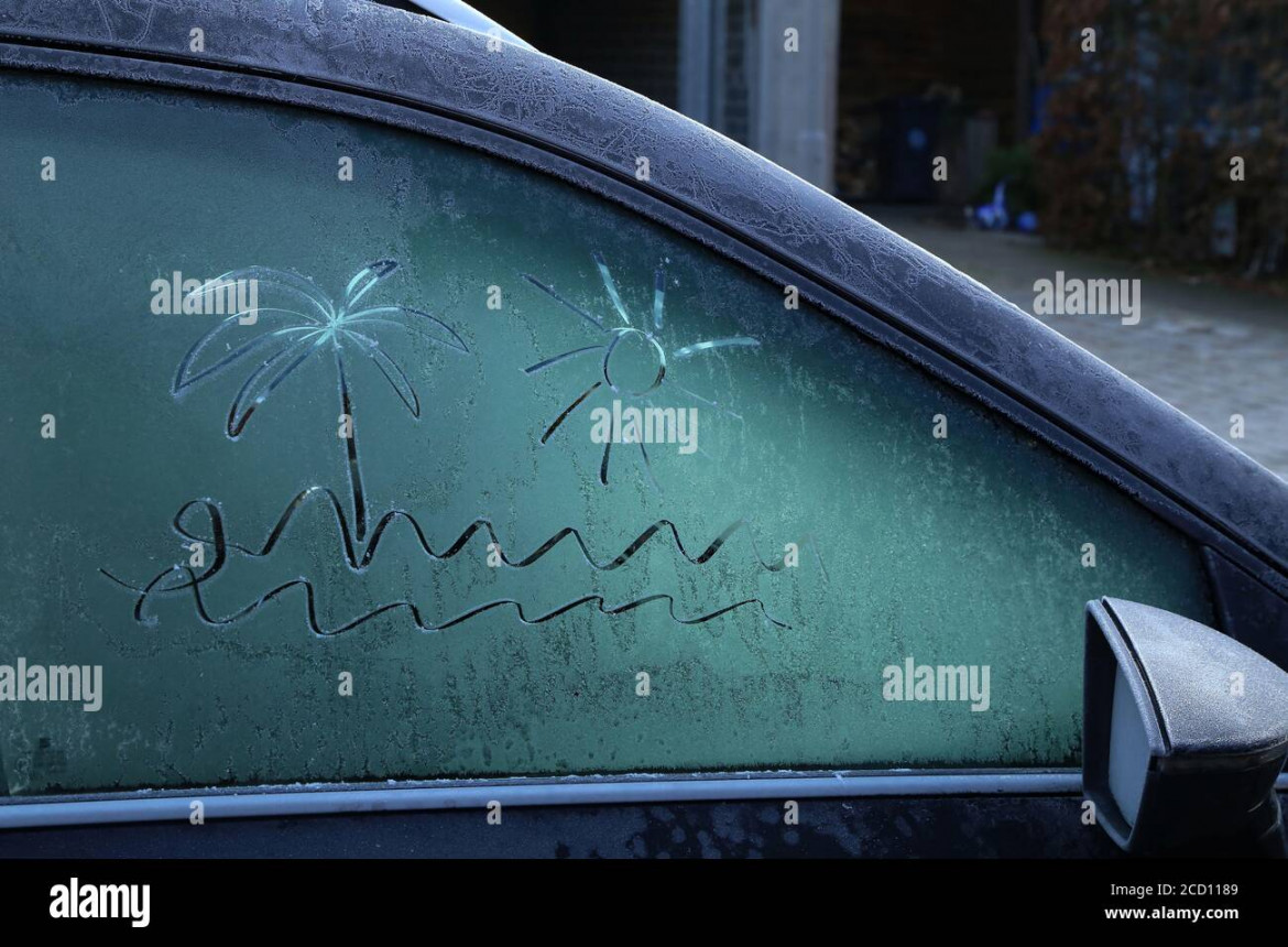 Drawing on a frozen car window on a frosty morning Stock Photo - Alamy